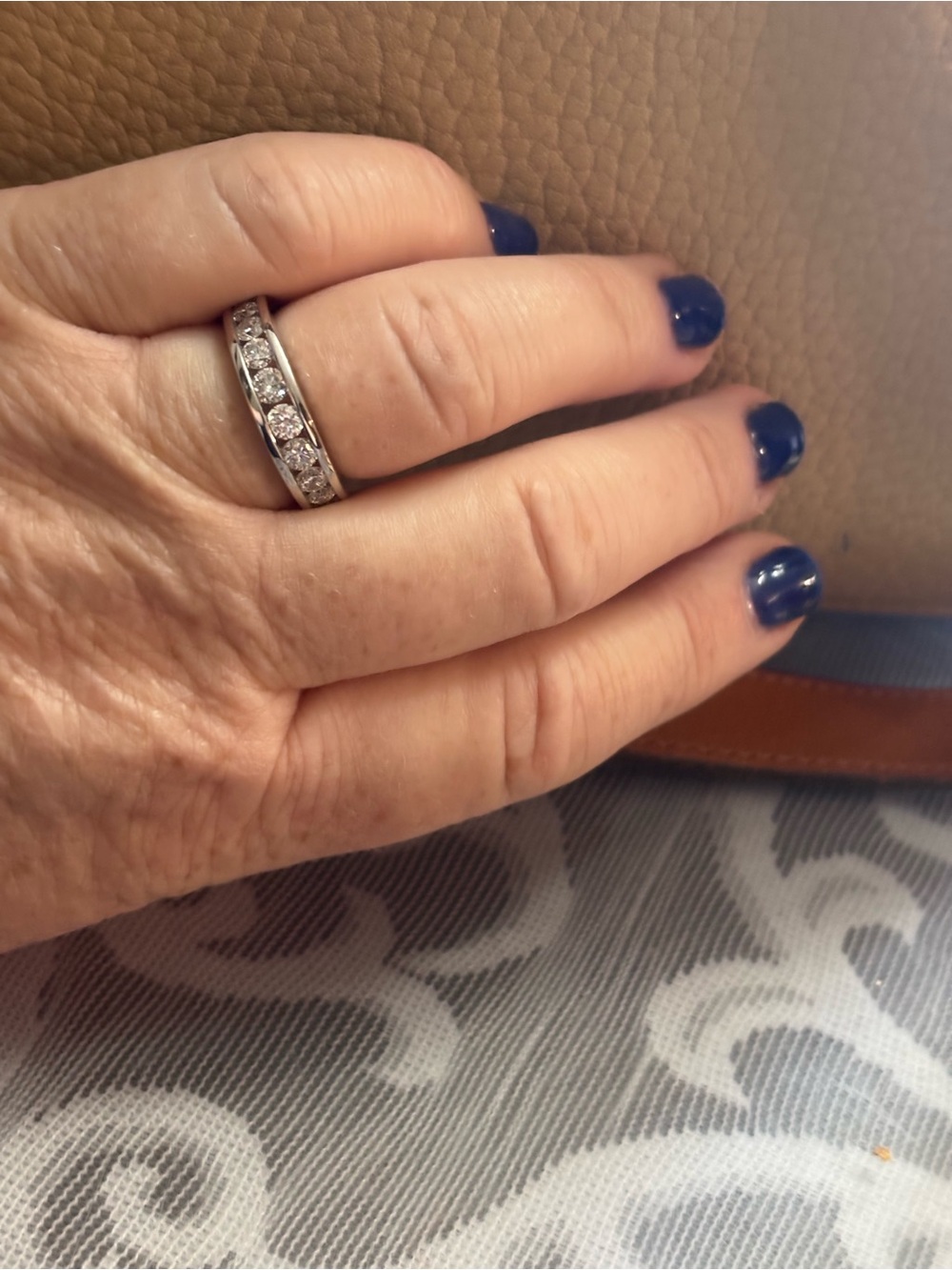 white gold  plated silver band channel set lab diamonds .